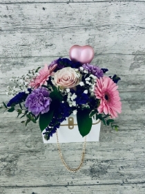 White handbag with purple, pink and white flowers